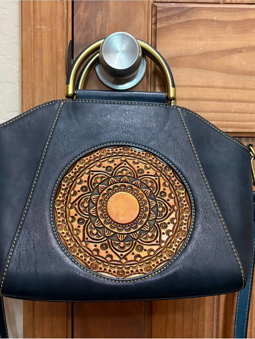Source Unknown Black Leather Shoulder Bag with Gold Embossed Medallion